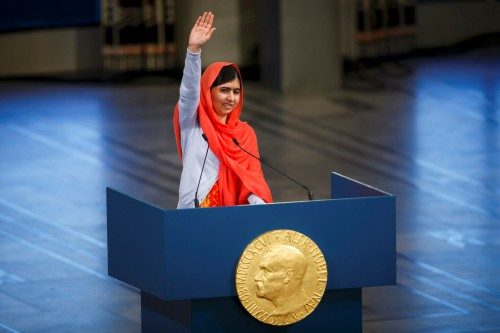 Nobel Peace Prize laureate Yousafzai waves as she delivers a speech during the Nobel Peace Prize awards ceremony at the City Hall in Oslo