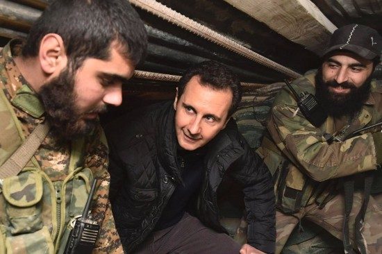 Syrian President Bashar al-Assad talks to soldiers during his visit to Jobar, northeast of Damascus