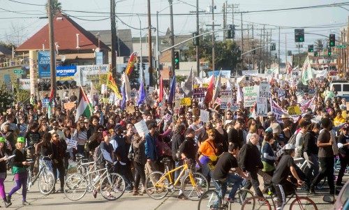 Demonstrators attend a protest march in honor of Martin Luther King Jr. Day in Oakland, California