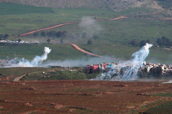 Smoke rises from shells fired from Israel over al-Wazzani area in southern Lebanon