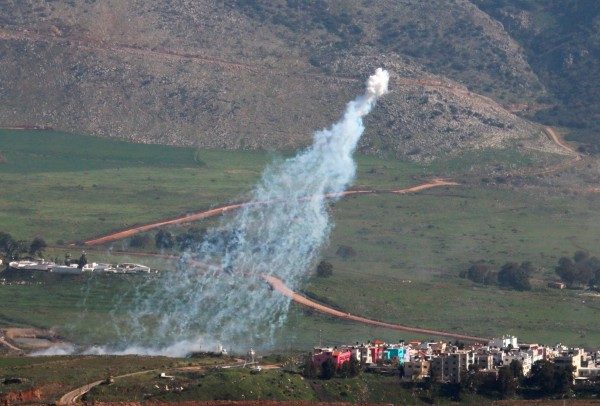 Smoke rises from shells fired from Israel over al-Wazzani area in southern Lebanon