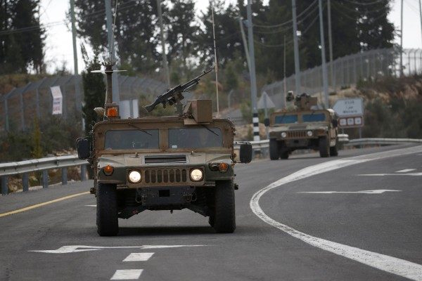 Israeli army armoured vehicles drive near Israel's border with Lebanon