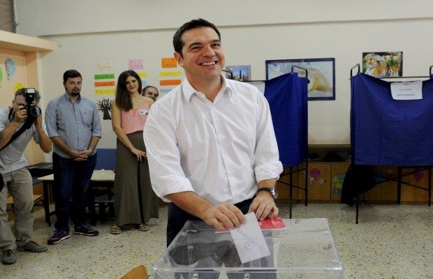 Former Greek prime minister and leader of leftist Syriza party Alexis Tsipras casts his ballot as he votes for the general elections at a polling station in Athens
