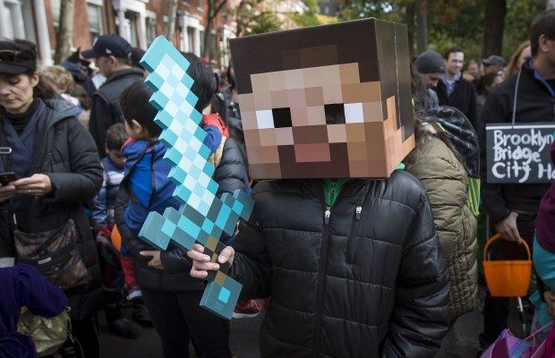 Child dressed as a character from Minecraft takes part in the Children's Halloween day parade at Washington Square Park in the Manhattan borough of New York