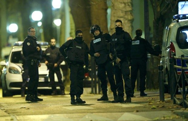 French special police forces secure the area during an operation to catch Paris attack fugitives in Saint-Denis