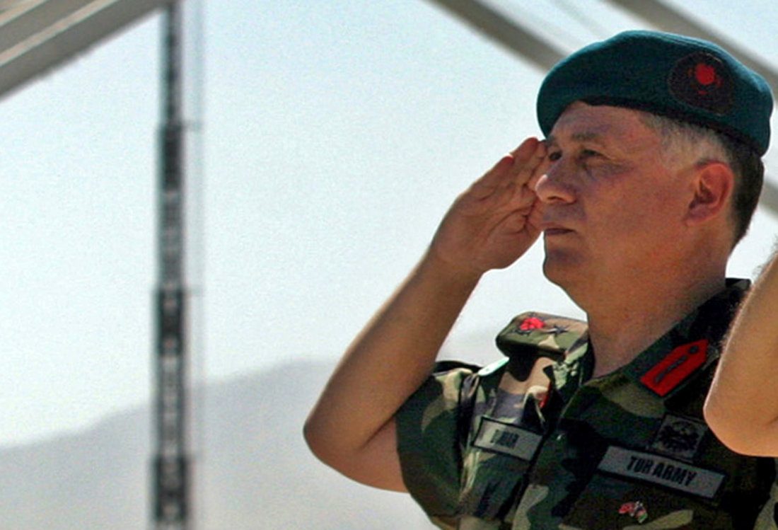 FILE PHOTO - Turkish Brigadier General Umit Dundar salutes during a handover of command of the Kabul Multinational Brigade in Kabul, Afghanistan July 20, 2005. REUTERS/Ahmad Masood/File Photo