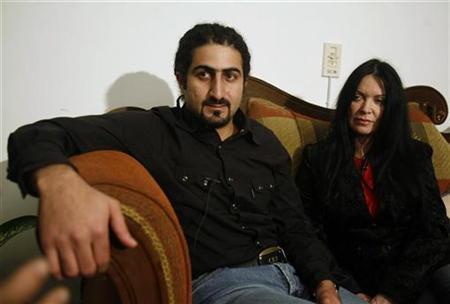Omar Bin Laden, son of Osama Bin Laden, and his British wife, Zaina al Sabah-Bin Laden talk during an interview with Reuters in a Cairo suburb, January 23, 2008. REUTERS/Asmaa Waguih