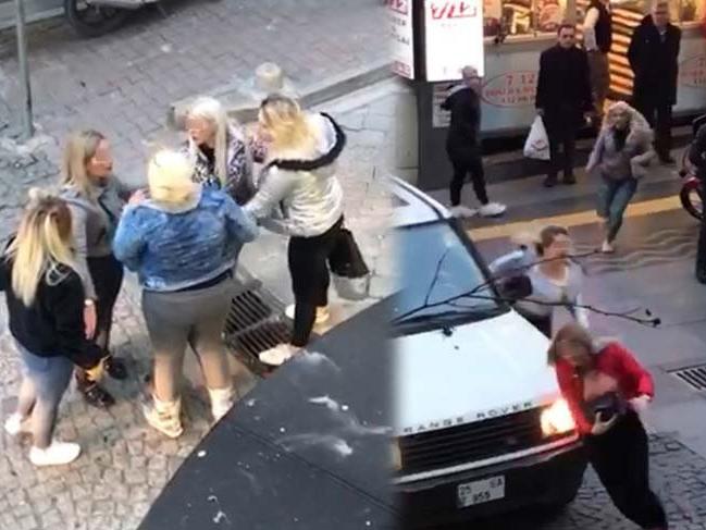Kızlar cadde ortasında kavga etti, çevredekiler seyretti